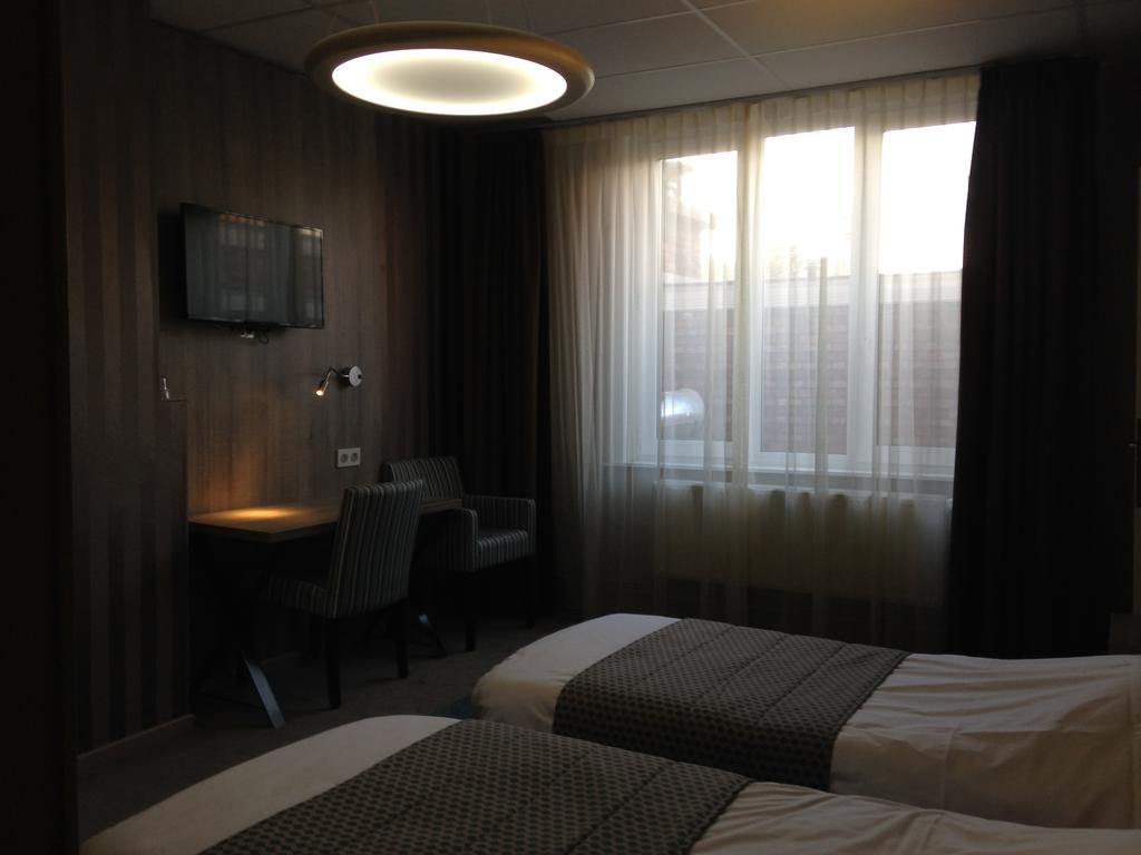 Hotel Mille Colonnes Leuven Rum bild
